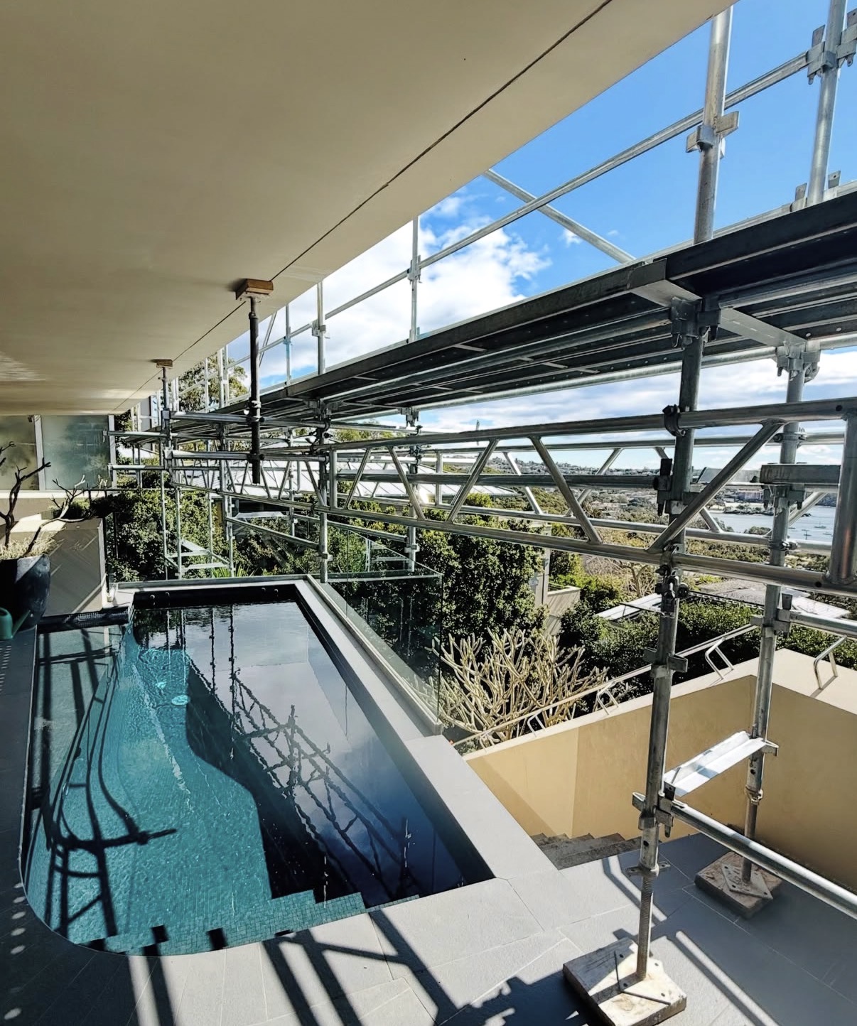 Scaffolding platform over pool overlooking Mosman harbour Sydney